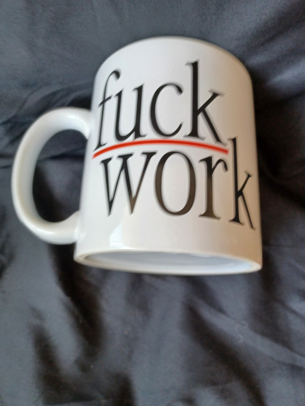 Source Unknown White Mug with Bold Black and Red Text